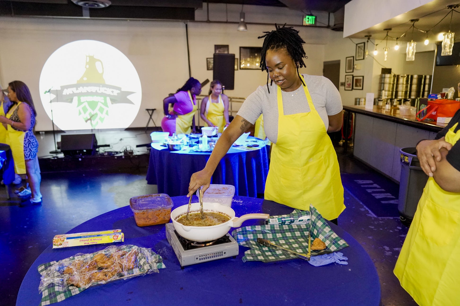 Cooking class students preparing gourmet brunch dishes and S&S Cookin at Atlantucky 