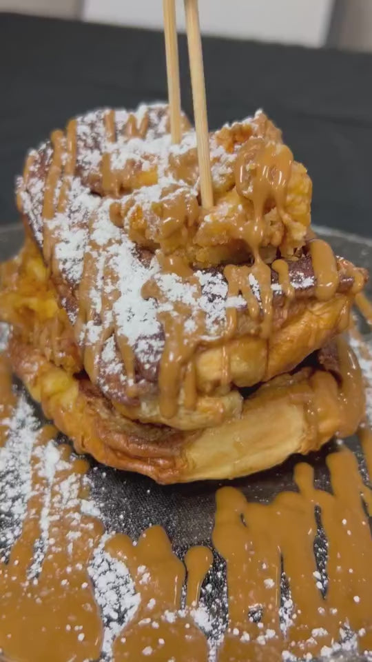 Cooking class students preparing gourmet Bourbon Biscoff French Toast and Chicken 